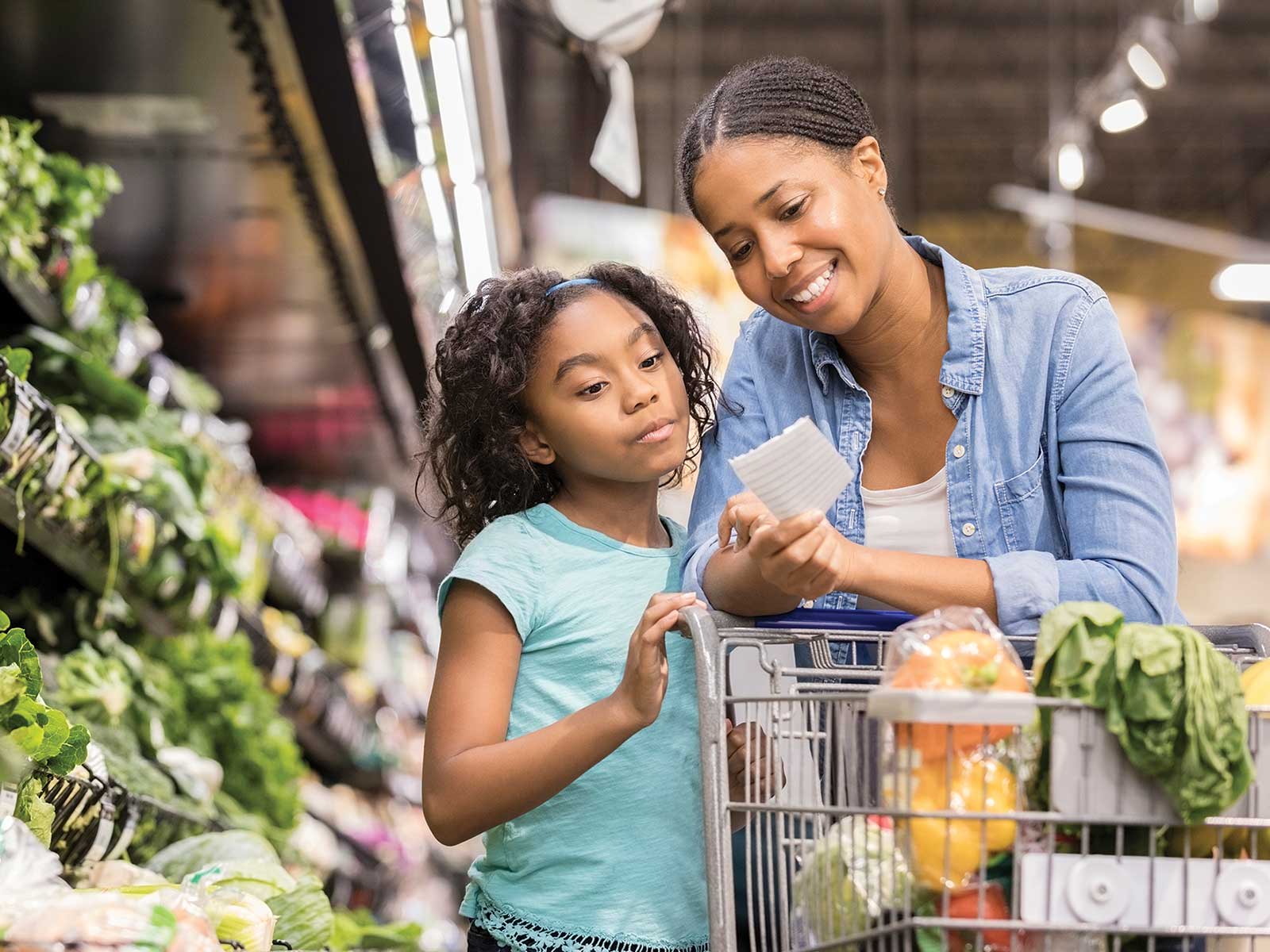 Mother and daughter shopping for healthy foods